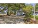 Charming two-story home nestled among mature trees, offering a serene and private setting at 409 2Nd Ave. S, Myrtle Beach, SC 29577
