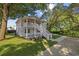 Charming two-story home with a spacious front yard, inviting staircase, and lovely curb appeal at 409 2Nd Ave. S, Myrtle Beach, SC 29577