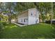 Charming home with green lawn and trees surrounding the property at 409 2Nd Ave. S, Myrtle Beach, SC 29577