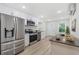 Modern kitchen with stainless steel appliances and white cabinets offering ample counter space at 409 2Nd Ave. S, Myrtle Beach, SC 29577