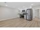 Modern kitchen features stainless steel appliances, granite countertops, and sleek white cabinetry at 409 2Nd Ave. S, Myrtle Beach, SC 29577