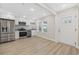 Bright kitchen with stainless steel appliances and white cabinets at 409 2Nd Ave. S, Myrtle Beach, SC 29577