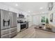 Modern kitchen with stainless steel appliances and white cabinets at 409 2Nd Ave. S, Myrtle Beach, SC 29577