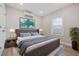 Comfortable bedroom with a large bed, complemented by stylish decor and natural light from the window at 409 2Nd Ave. S, Myrtle Beach, SC 29577