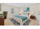A spacious bedroom features modern decor, a cozy bed, and an accent rug, creating a peaceful retreat at 409 2Nd Ave. S, Myrtle Beach, SC 29577