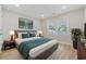 A beautifully staged bedroom showcases modern decor, a cozy bed, and an accent rug at 409 2Nd Ave. S, Myrtle Beach, SC 29577