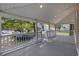 Spacious porch with a white railing, offering a perfect spot to enjoy the neighborhood views at 409 2Nd Ave. S, Myrtle Beach, SC 29577
