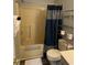 Bathroom with a shower and tub combo and shelving for storage at 4107 Pinehurst Circle # Dd-15, Little River, SC 29566