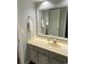 Bathroom vanity with large mirror and view into adjoining room at 4107 Pinehurst Circle # Dd-15, Little River, SC 29566