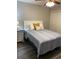 Cozy bedroom featuring a comfortable bed, wood floors, and a ceiling fan at 4107 Pinehurst Circle # Dd-15, Little River, SC 29566