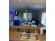 Open-concept living space with kitchen bar overlooking the living and dining areas and outdoor balcony at 4107 Pinehurst Circle # Dd-15, Little River, SC 29566
