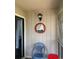 Enclosed front porch with a light and welcome sign at 4107 Pinehurst Circle # Dd-15, Little River, SC 29566