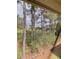View through screen of trees and waterway at 4107 Pinehurst Circle # Dd-15, Little River, SC 29566