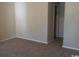 Comfortable bedroom with neutral walls and carpet and an open door at 411 Cambridge Circle # D5, Murrells Inlet, SC 29576