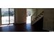 Open-concept living room featuring sliding glass doors for ample natural light at 411 Cambridge Circle # D5, Murrells Inlet, SC 29576