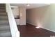 Cozy living room featuring staircase and neutral walls and modern flooring at 411 Cambridge Circle # D5, Murrells Inlet, SC 29576