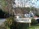Street view of Cambridge At Jamestown community sign surrounded by trees at 411 Cambridge Circle # D5, Murrells Inlet, SC 29576