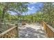 Expansive back deck overlooking the serene water offers peaceful outdoor living at 4131 Gunter Lake Rd., Galivants Ferry, SC 29544