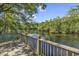Waterfront back deck overlooking the serene water for outdoor living at 4131 Gunter Lake Rd., Galivants Ferry, SC 29544