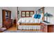 This bright bedroom offers a decorative fireplace, wood flooring, and plenty of natural light at 4131 Gunter Lake Rd., Galivants Ferry, SC 29544
