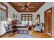 Charming bedroom with wood floors, large windows, and a comfortable bed at 4131 Gunter Lake Rd., Galivants Ferry, SC 29544