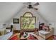 This bonus room is filled with natural light and wood floors at 4131 Gunter Lake Rd., Galivants Ferry, SC 29544