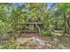 Charming front exterior surrounded by mature trees and natural landscape at 4131 Gunter Lake Rd., Galivants Ferry, SC 29544