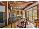 Kitchen bar with black countertops, barstool seating, brick backsplash and natural light at 4131 Gunter Lake Rd., Galivants Ferry, SC 29544