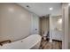 This stylish bathroom features a modern soaking tub, elegant fixtures, and wood-look flooring at 4145 Highway 308, Galivants Ferry, SC 29544