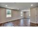 Well-lit bedroom features wood-look flooring and multiple windows for ample natural light at 4145 Highway 308, Galivants Ferry, SC 29544