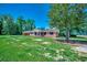 Inviting brick home with a carport, classic black shutters, and a spacious green lawn at 4145 Highway 308, Galivants Ferry, SC 29544
