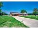 Cozy brick home with an attached carport surrounded by a lush lawn, offering classic curb appeal at 4145 Highway 308, Galivants Ferry, SC 29544