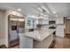 A beautifully updated kitchen features stainless steel appliances, modern lighting, and marble countertops at 4145 Highway 308, Galivants Ferry, SC 29544