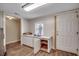 A kitchen area shows a window, sink, cabinets, a door and wood-look flooring at 4145 Highway 308, Galivants Ferry, SC 29544