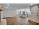 Bright, open-concept living room featuring white walls, wood floors, and a kitchen island at 4145 Highway 308, Galivants Ferry, SC 29544