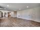 Spacious living room with wood-look flooring, white trim, and recessed lighting leads into the kitchen at 4145 Highway 308, Galivants Ferry, SC 29544