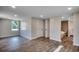 The primary bedroom boasts wood-look floors and an ensuite bath with a soaking tub at 4145 Highway 308, Galivants Ferry, SC 29544