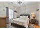 Cozy bedroom with a queen-sized bed, plush rug, and decorative ceiling fan at 4251 Hibiscus Dr. # 202, Little River, SC 29566