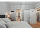 Bright bedroom with closet space, a view of the kitchen and an ensuite bathroom at 4251 Hibiscus Dr. # 202, Little River, SC 29566