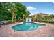 Enjoy the inviting community pool surrounded by lush greenery and lounge chairs at 4251 Hibiscus Dr. # 202, Little River, SC 29566