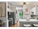 Open kitchen with wood floors, stainless steel appliances, and an eat-in breakfast bar at 4251 Hibiscus Dr. # 202, Little River, SC 29566