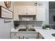 Bright kitchen featuring pristine white cabinetry and countertops perfect for casual entertaining and dining at 4251 Hibiscus Dr. # 202, Little River, SC 29566