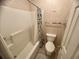 Cozy full bath with tub and shower combination, toilet, and towel bars at 4430 Eastport Blvd. # L-11, Little River, SC 29566