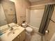 Full bath with tub and shower combination, sink, and commode at 4430 Eastport Blvd. # L-11, Little River, SC 29566