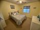 Comfortable bedroom with carpet, ceiling fan, lots of natural light, and closet at 4430 Eastport Blvd. # L-11, Little River, SC 29566