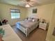 Comfortable bedroom with carpet, ceiling fan, lots of natural light, and closet at 4430 Eastport Blvd. # L-11, Little River, SC 29566