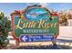 Little River Waterfront sign decorated with holiday decorations and a boat drawing on top at 4430 Eastport Blvd. # L-11, Little River, SC 29566