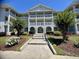 Condo entrance with steps and landscaping at 4430 Eastport Blvd. # L-11, Little River, SC 29566