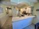 Kitchen with breakfast bar and view to hallway at 4430 Eastport Blvd. # L-11, Little River, SC 29566