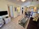 Inviting living room with tile flooring, comfortable seating, and seamless flow to the dining area and kitchen at 4430 Eastport Blvd. # L-11, Little River, SC 29566